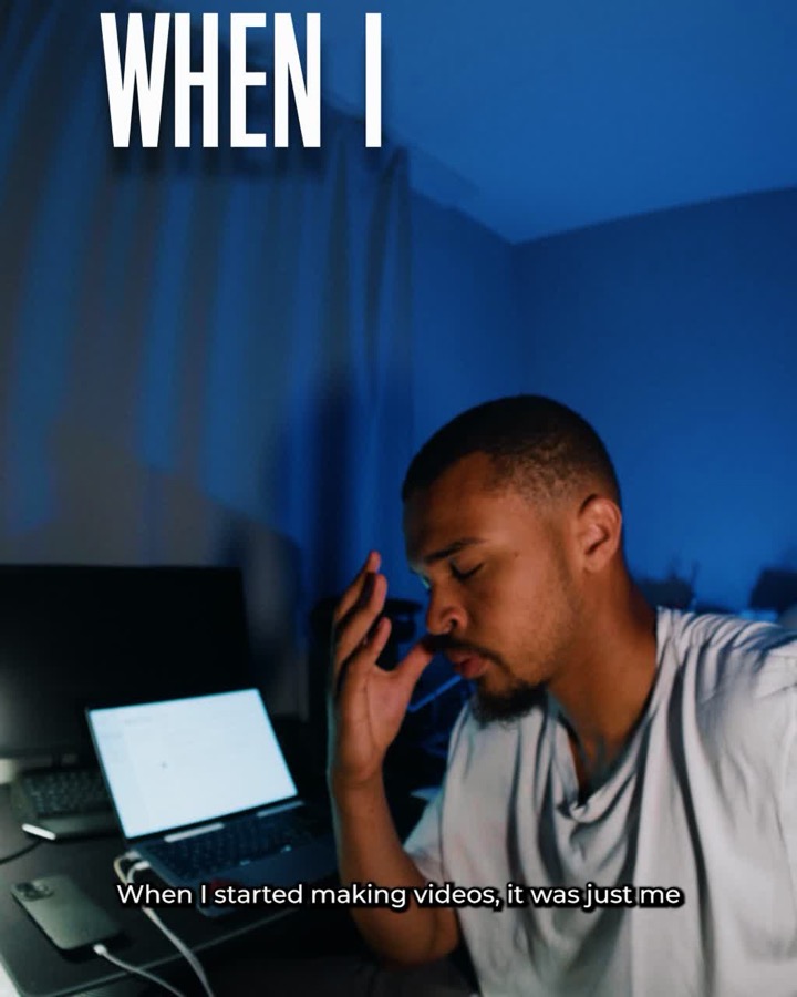 Creator at a desk at night with subtitles